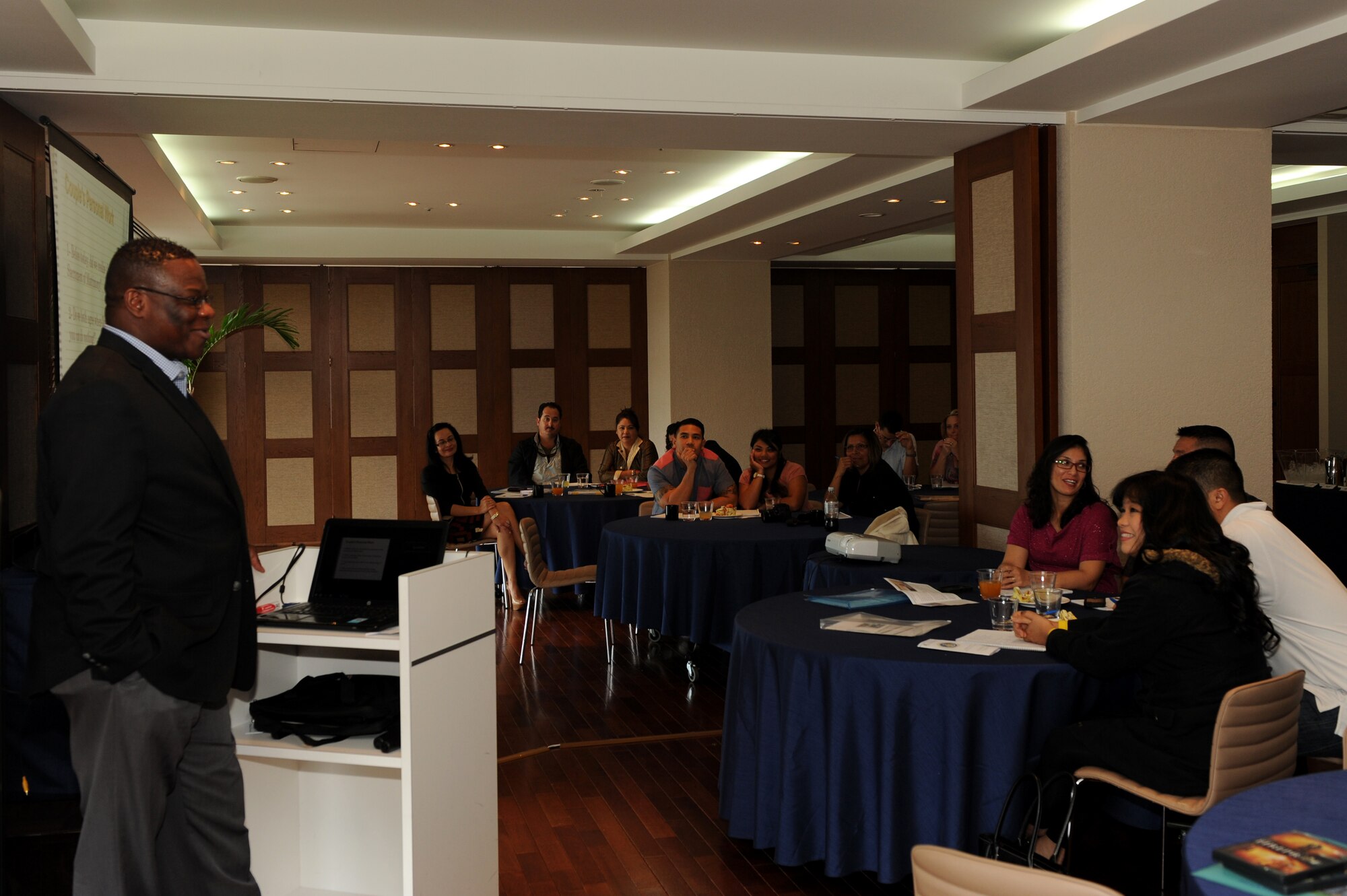 U.S. Air Force Chaplain (Capt.) Onyema Okorie, 18th Wing Chapel Catholic service chaplain, speaks to the couples participating in a three-day, two-night marriage retreat at the Kafuu Resort on Okinawa, Japan, March 15, 2014. Couples attending the retreat participated in group discussions, dialogue with their spouses, a daily mass and Sunday worship, as well as a romantic dinner with performances from local groups. (U.S. Air Force photo by Airman 1st Class Hailey R. Staker) 