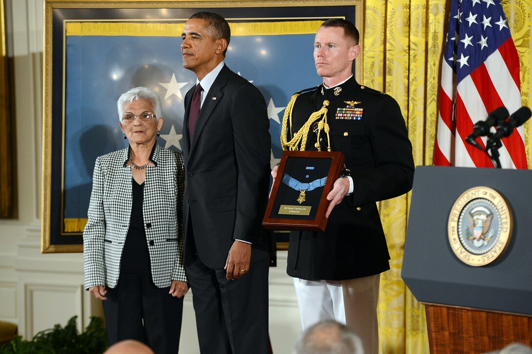 Alice Mendoza accepts the Medal of Honor on behalf of her late husband, Army Staff Sgt. Manuel V. Mendoza, from President Barack Obama during a ceremony at the White House, March 18, 2014. Mendoza distinguished himself by acts of gallantry and intrepidity above and beyond the call of duty while serving as a platoon sergeant assigned to the 88th Infantry Division's Company B, 350th Infantry Regiment, during combat operations against an armed enemy on Mt. Battaglia, Italy, Oct. 4, 1944.