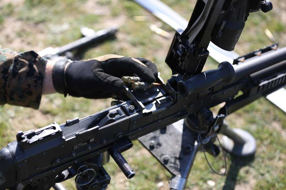 MIHAIL KOGALNICEANU, Romania - Lance Cpl. Jarod Parker, a Marine with Weapons Company, 3rd Battalion, 8th Marines, assigned to Black Sea Rotational Force 14, inserts tracer rounds into an M240B machine gun while he participates in routine weapons exercises at Mihail Kogalniceanu, Romania, March 14, 2014. BSRF-14 is a contingent of Marines and sailors in the Black Sea, Balkans and Caucasus regions that work with partner nations to maintain proven partnerships while building military capacity, promoting regional stability, and providing the capability for rapid crisis response throughout Eastern Europe as directed by U.S. Marine Corps Forces Europe and Africa, U.S. European Command.