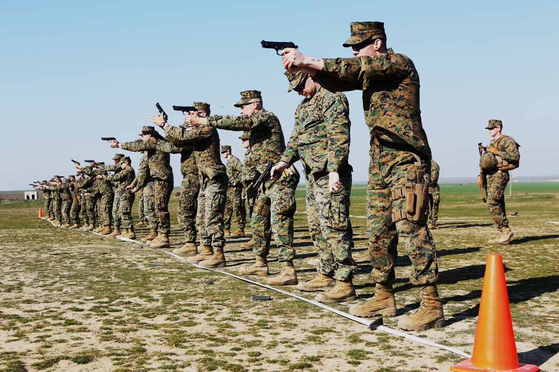 MIHAIL KOGALNICEANU, Romania - U.S. Marines with Black Sea Rotational Force 14 from 3rd Battalion, 8th Marines fire M9 pistols while they participate in routine weapons exercises at Mihail Kogalniceanu, Romania, March 14, 2014. BSRF-14 is a contingent of Marines in the Black Sea, Balkans and Caucasus regions that work with partner nations and maintains proven partnerships while building military capacity, promoting regional stability, and providing the capability for rapid crisis response throughout Eastern Europe as directed by U.S. Marine Corps Forces Europe and Africa, U.S. European Command.