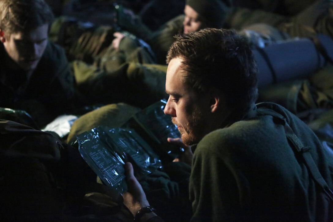 A soldier with Host Nation Support Battalion reviews a day’s worth of Norwegian field rations, or FRs, during Cold Response 14 at Elvegaardsmoen Norway, March 18, 2014. FRs are light and durable, and based around freeze-dried meals, which retain taste, consistency and the original nutrients after water is added. Cold Response 14 is a Norwegian-led multinational exercise above the Arctic Circle designed prepare for high-intensity cold-weather operations with nearly 16,000 troops from 16 different countries. 