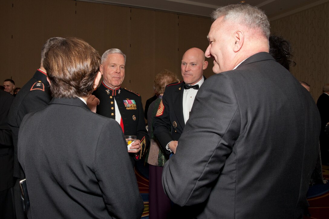 Sgt. Maj. Micheal P. Barrett, the 17th Sergeant Major of the Marine Corps, greets guests of the Marine Corps University Foundation Semper Fidelis Award Ceremony and Dinner at the Crystal Gateway Marriot, Arlington, Va., Feb. 22, 2014. (U.S. Marine Corps photo by Lance Cpl. Alejandro Sierras/Released)