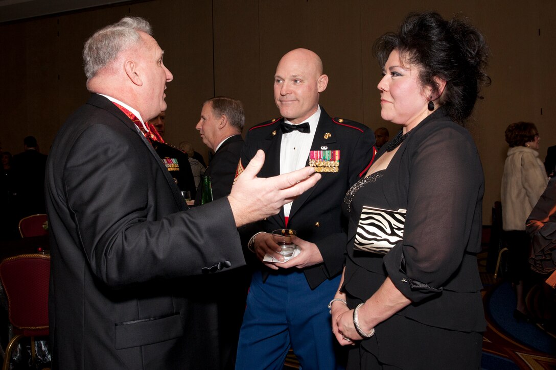 Sgt. Maj. Micheal P. Barrett, the 17th Sergeant Major of the Marine Corps, and Susan Barrett are announced at the Marine Corps University Foundation Semper Fidelis Award Ceremony and Dinner at Crystal Gateway Marriot, Arlington, Va., Feb. 22, 2014. (U.S. Marine Corps photo by Lance Cpl. Alejandro Sierras/Released)