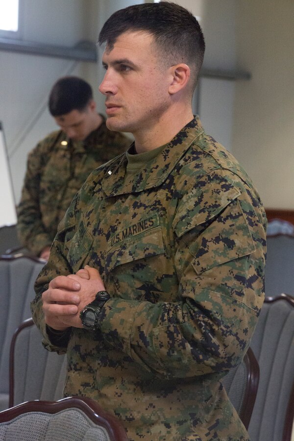MIHAIL KOGALNICEANU, Romania - U.S. Marine Corps 1st Lt. Thomas Perna, infantry officer, weapons company platoon commander, 3rd Battalion, 8th Marines, attends the Ash Wednesday service at Mihail Kogalniceanu Air Base, Mihail Kogalniceanu, Romania, March 5, 2014, offered by Lt. Jim Rutan, U.S. Navy chaplain. Black Sea Rotational Force 14 (BSRF-14) is a contingent of Marines and sailors in the Black Sea, Balkans and Caucasus regions that work with partner nations and maintains proven partnerships while building military capacity, promoting regional stability, and providing the capability for rapid crisis response throughout Eastern Europe as directed by U.S. Marine Corps Forces Europe and Africa, and U.S. European Command. (U.S. Marine Corps photo by Lance Cpl. Samantha A. Barajas, Combat Camera, 2nd Marine Division/Released)