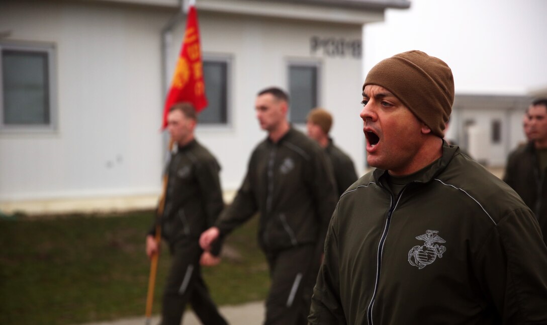 MIHAIL KOGALNICEANU, Romania - Sergeant Maj. Michael Rowan, sergeant major of 3rd Battalion, 8th Marine Regiment, 2nd Marine Division, and part of Black Sea Rotational Force 14, marches the Marines and sailors to a halt after completing a battalion-level three-mile run around Mihail Kogalniceanu Air Base, Romania, March 7, 2014. Black Sea Rotational Force 14 is a task force of Marines and sailors tasked with maintaining positive relations with partner nations, regional stability and increase interoperability while providing the capability for rapid crisis response, as directed by U.S. European Command, in the Black Sea, Balkan and Caucasus regions of Eastern Europe.