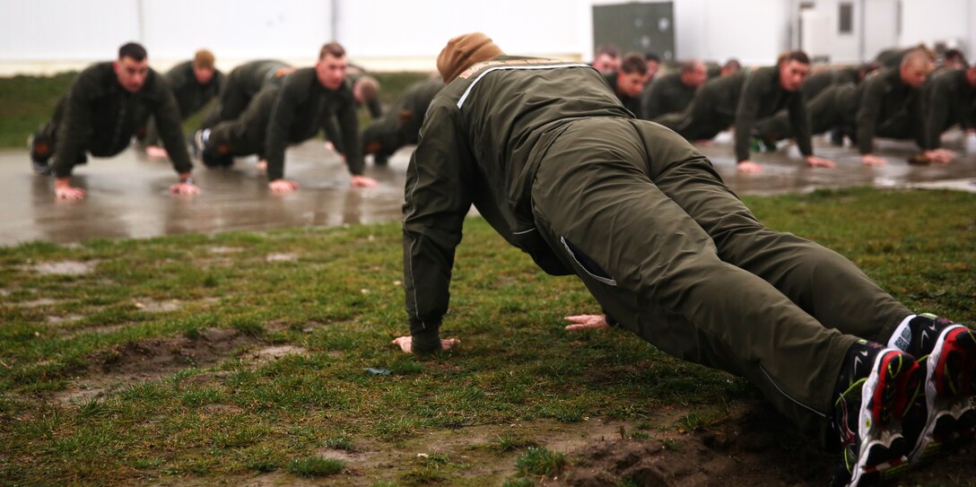 MIHAIL KOGALNICEANU, Romania - The Marines and sailors of Black Sea Rotational Force 14 with 3rd Battalion, 8th Marine Regiment, 2nd Marine Division execute push-ups after completing a battalion three-mile run around Mihail Kogalniceanu Air Base, Romania, March 7, 2014. Black Sea Rotational Force 14 is a task force of Marines in the Black Sea, Balkan and Caucasus regions of Eastern Europe to maintain positive relations with partner nations, regional stability and increase military operability while being able to respond to crises in the region.