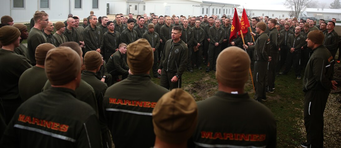 MIHAIL KOGALNICEANU, Romania - Lieutenant Col. Trevor Hall, commanding officer of 3rd Battalion, 8th Marine Regiment, 2nd Marine Division, and part of Black Sea Rotational Force 14, talks with his Marines and sailors after completing the first battalion three-mile run on Mihail Kogalniceanu Air Base, Romania, March 7, 2014. The battalion arrived at MK Air Base Last week, and is serving as BSRF-14 until September 2014. Black Sea Rotational Force 14 is a contingent of Marines with the task of maintaining positive relationships with partner nations, regional stability and increasing interoperability while providing the capability for rapid crisis response, as directed by U.S. European Command, in the Black Sea, Balkan and Caucasus regions of Eastern Europe.
