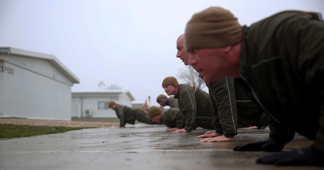 MIHAIL KOGALNICEANU, Romania - The Marines and sailors of Black Sea Rotational Force 14 with 3rd Battalion, 8th Marine Regiment, 2nd Marine Division execute push-ups after completing a battalion three-mile run around Mihail Kogalniceanu Air Base, Romania, March 7, 2014. Black Sea Rotational Force 14 is a task force of Marines in the Black Sea, Balkan and Caucasus regions of Eastern Europe to maintain positive relations with partner nations, regional stability and increase military operability while being able to respond to crises in the region.