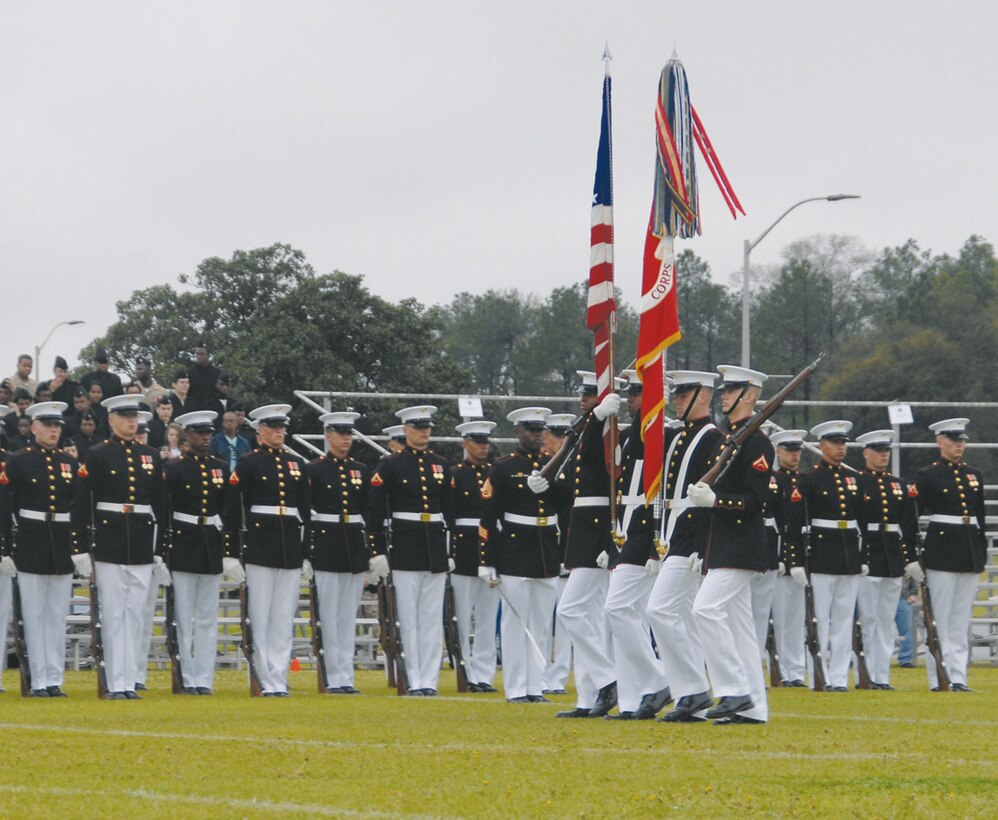 The Marine Corps Color Guard presents the national flag and Marine Corps official colors during the Battle Colors Ceremony held March 17 at Schmid Field aboard Marine Corps Logistics Base Albany.