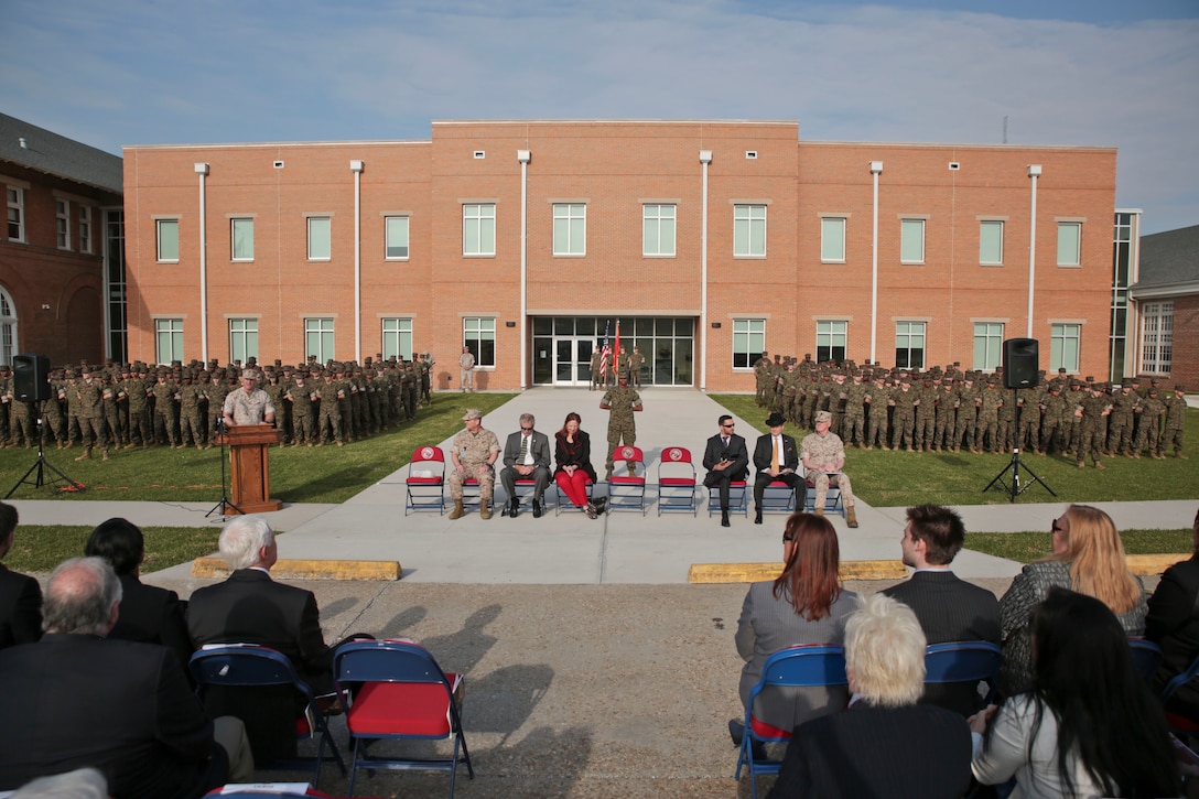 Retired Marine Col. Bill Davis, commandant of New Orleans Military and Maritime Academy, gives a speech to community members during a dedication ceremony at NOMMA March 20, 2014. The event also featured speeches from Lt. Gen. Richard P. Mills, the commander of Marine Forces Reserve, as well as other local military and political leaders. “Right now, we are 360 cadets strong and we have nowhere to go but up,” said Davis. “Here at NOMMA, we have smart and physically fit cadets that will contribute to today’s society.” Expansion is in the school’s plans, with ideas to develop more facilities to reach the state limit of 750 cadets.