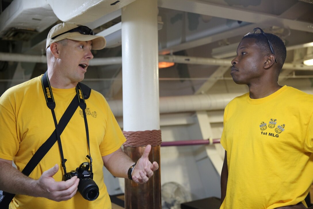 Senior Cheif Petty Officer Dave Bennett and Cheif Petty Officer Isaac Jenkins discuss the improvements they plan to make to the cheif petty officer's mess aboard the USS Iowa in Los Angeles, March 15, 2014. The USS Iowa was built in 1940 and served for 50 years.