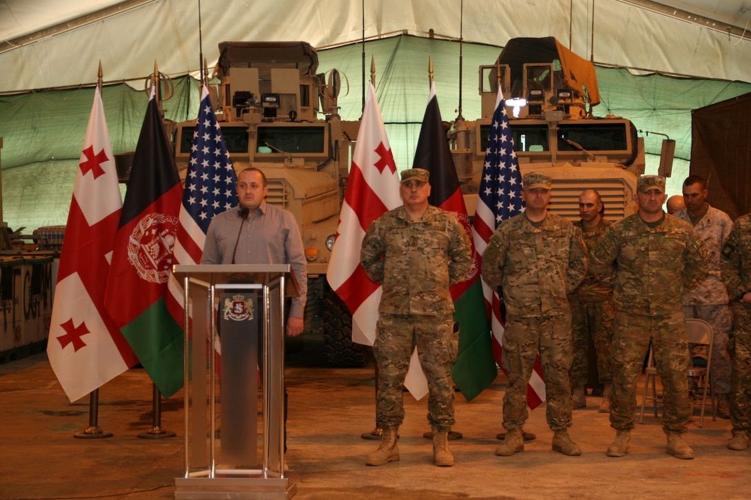 Georgian President Giorgi Margvelashvili addresses the soldiers with the 31st Light Infantry Battalion from the Republic of Georgia and U.S. Marines with Georgian Liaison Team 11 during his visit to Camp Leatherneck, Helmand province, Afghanistan, March 15, 2014. Following his speech, President Margvelashvili presented several awards to both his soldiers and Marines with GLT-11 to show his appreciation for the outstanding work the Georgians and Marines have accomplished.