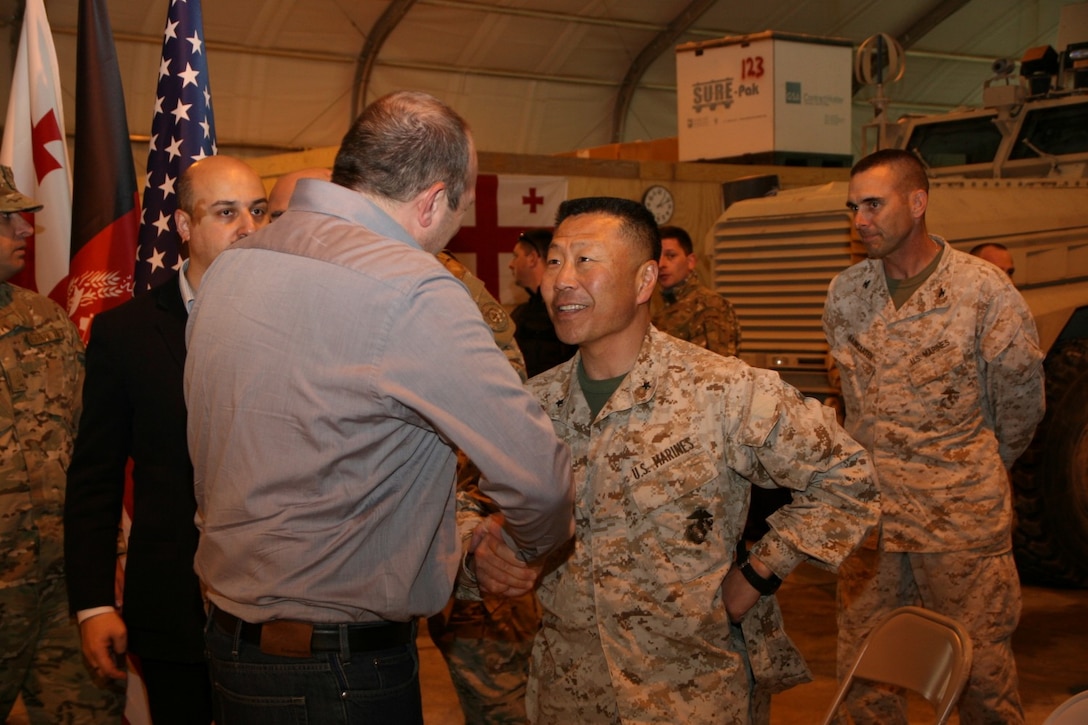 Brigadier Gen. Daniel D. Yoo, right, Regional Command (Southwest) commanding general, shakes hands with Georgian President Giorgi Margvelashvili during the president's visit to Camp Leatherneck, Helmand province, Afghanistan, March 15, 2014. This was the first time President Margvelashvili has visited his troops in Afghanistan since taking office during November 2013.