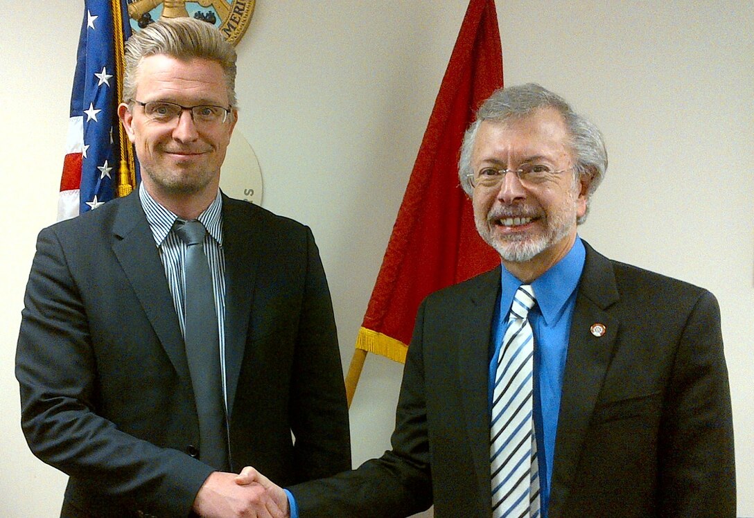 Mr. Hans Denker Thulstrup (left), UNESCO, is welcomed by Mr. Robert Pietrowsky (right), Director of the USACE Institute for Water Resources and the International Center for Integrated Water Resources Management (ICIWaRM), under the auspices of UNESCO.