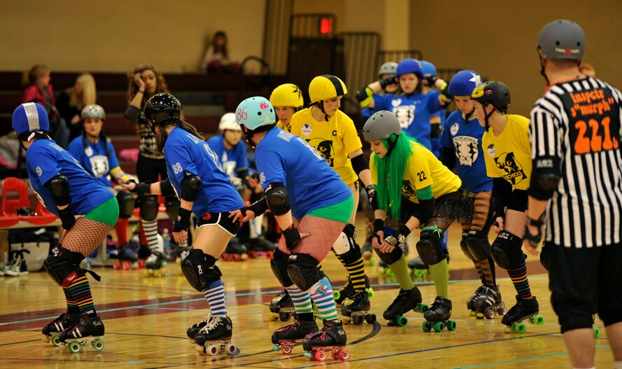 Members of the Rokettes and KimChicks roller derby teams prepare for the start of a jam at U.S. Army Garrison Humphreys, Republic of Korea, March 8, 2014. Both teams are primarily made up of active duty military members and spouses from Osan and Humphreys, who compete during monthly bouts. (U.S. Air Force photo/Senior Airman Siuta B. Ika)