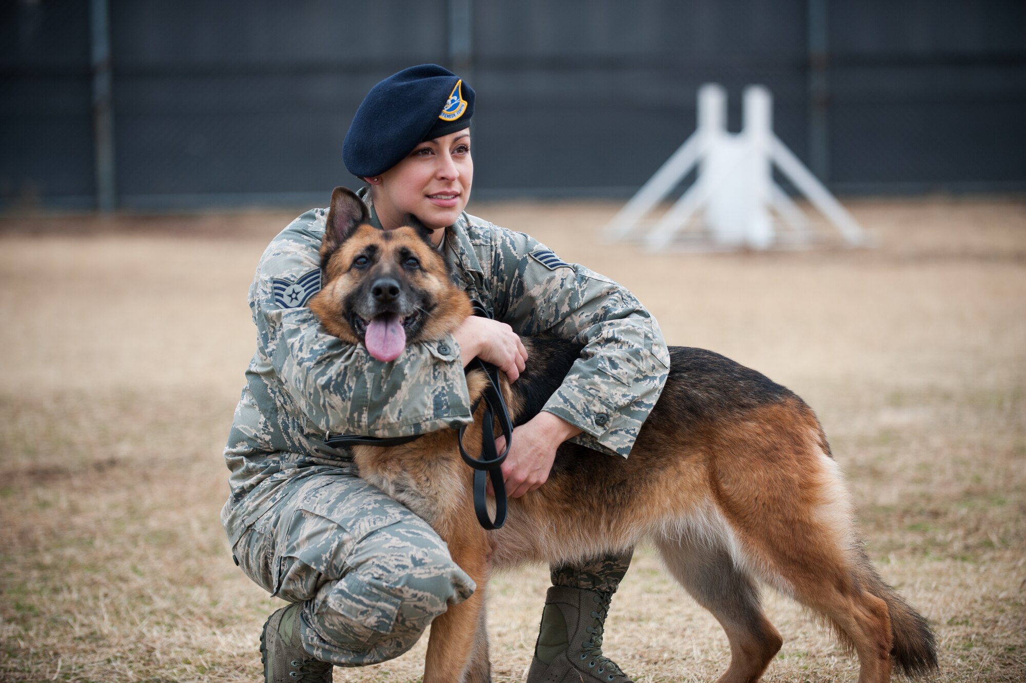 Staff Sgt. Monica Bizallion, 8th Security Forces Squadron military working dog handler, and Stella, 8th SFS military working dog, take a break after running through a confidence course at Kunsan Air Base, Republic of Korea, Mar. 13, 2014. Military working dog teams form a unique bond that cannot be broken. (U.S. Air Force photo by Staff Sgt. Clayton Lenhardt/Released)