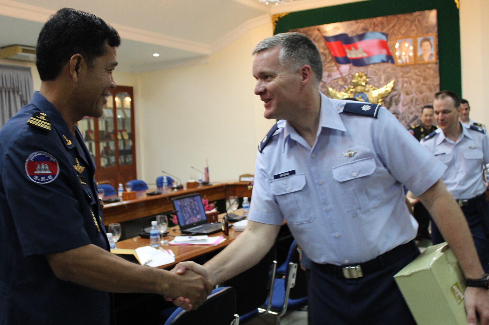 Lt Col Tony Meeks, Air War College student, thanks a member of the Royal Cambodian Armed Forces for hosting his class during an Air War College regional studies field study in Cambodia, March 13. The RCAF provided insight into the direction of the Cambodian Armed Forces and its security objectives, defense opportunities, and initiatives. As part of the Air War College Regional and Cultural Studies curriculum, students gained a field study understanding of other countries, March 1-14, 2014. (Courtesy Photo)