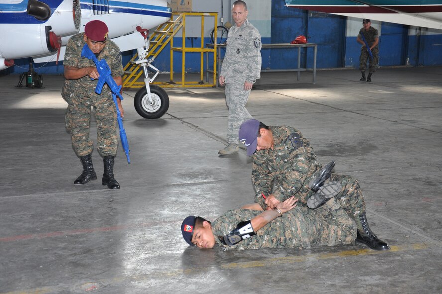 Master Sgt. Patrick Lombardo, 571st Mobility Support Advisory Squadron Security Forces air adivors, assesses the response of a Guatemalan aircraft security team during their capstone final event March 12 at La Aurora air base, Guatemala. "Their motivation to improve security for thier air assests is vital for any of their missions. To witness what we have taught them and see their abilities put into action is spot on and gratifying," Lombardo said.