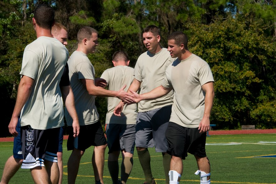Airmen from Detachment 7, 373rd Training Squadron shake hands after a soccer match on the Aderholt Fitness Center field at Hurlburt Field, Fla., March 19, 2014. Intramural soccer season is scheduled to begin June 2, and any Department of Defense card-holder may participate. (U.S. Air Force photo/Senior Airman Naomi Griego)