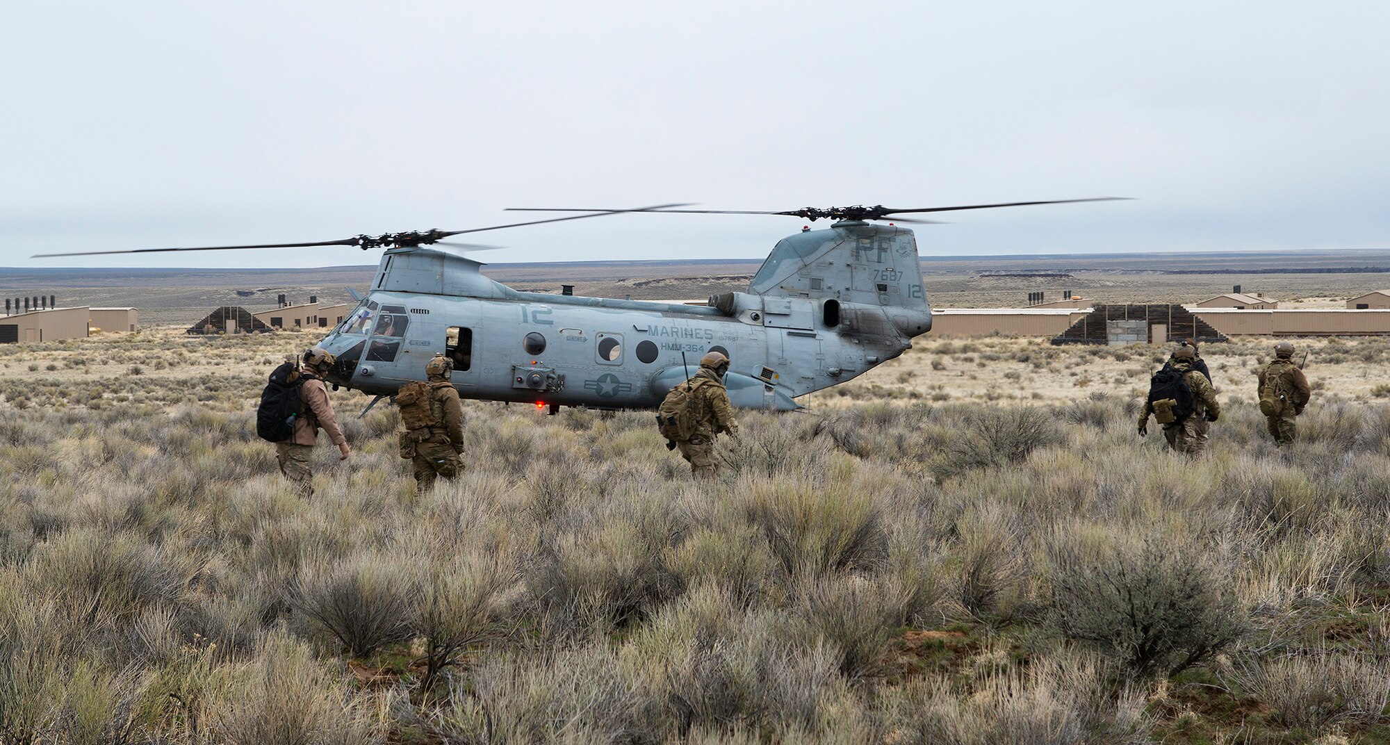 An Air Force combat controller team marches to an objective point at Juniper Butte Bombing Range near Mountain Home Air Force Base, Idaho, March 14, 2014. The CCT team completed different scenarios during Gunfighter Flag 14-2 exercise. The CCT was one part of the exercise, which consisted of all three MHAFB fighter squadrons, more than 300 visiting Marines and British partners. (U.S. Air Force photo by Tech. Sgt. JT May III/RELEASED)

