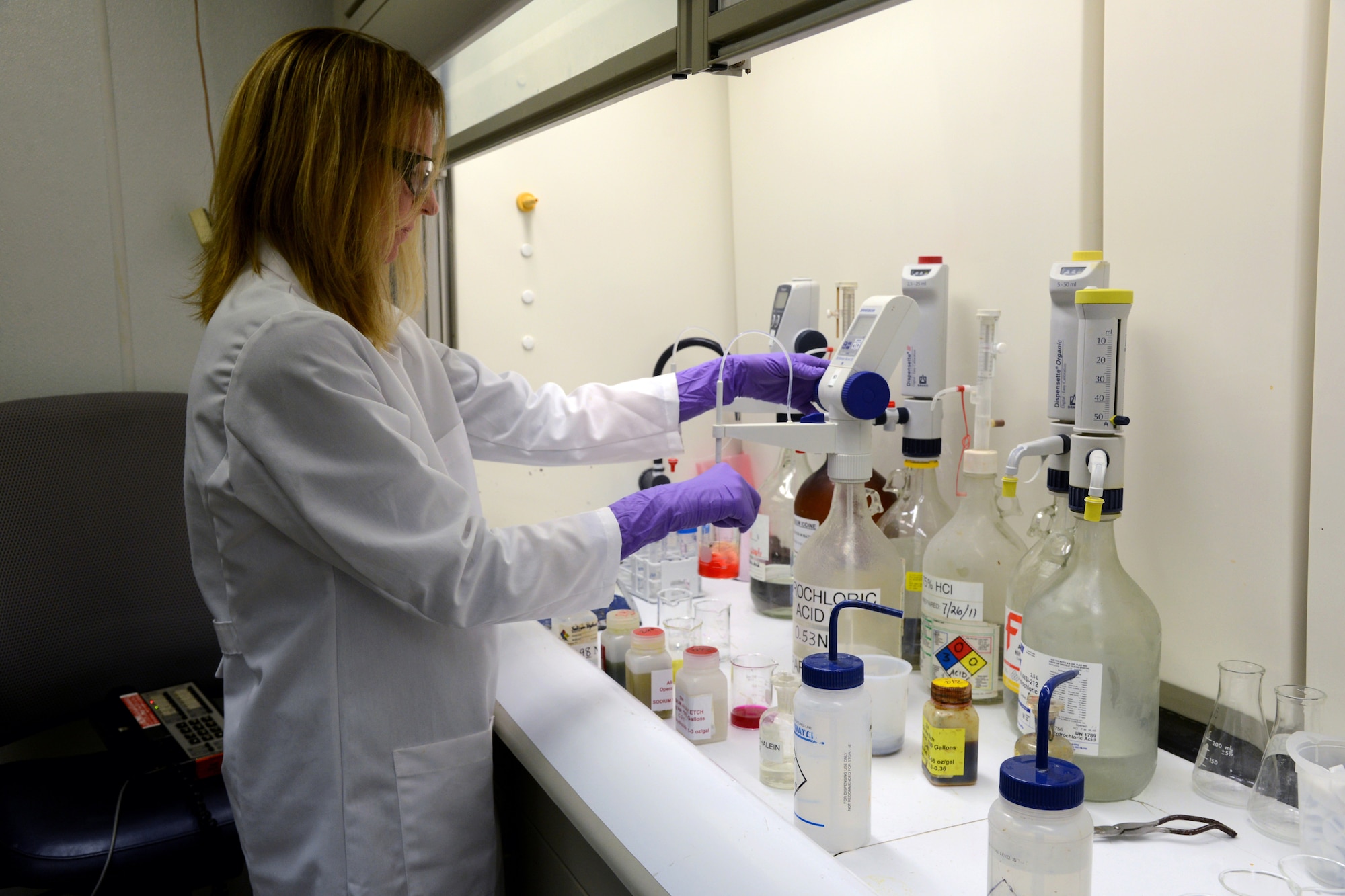 Heather Skaggs-Morrison, a chemist in the 76th Maintenance Support Squadron, performs an acid/base titration for the Plating Shop.  (Air Force photo by Kelly White)