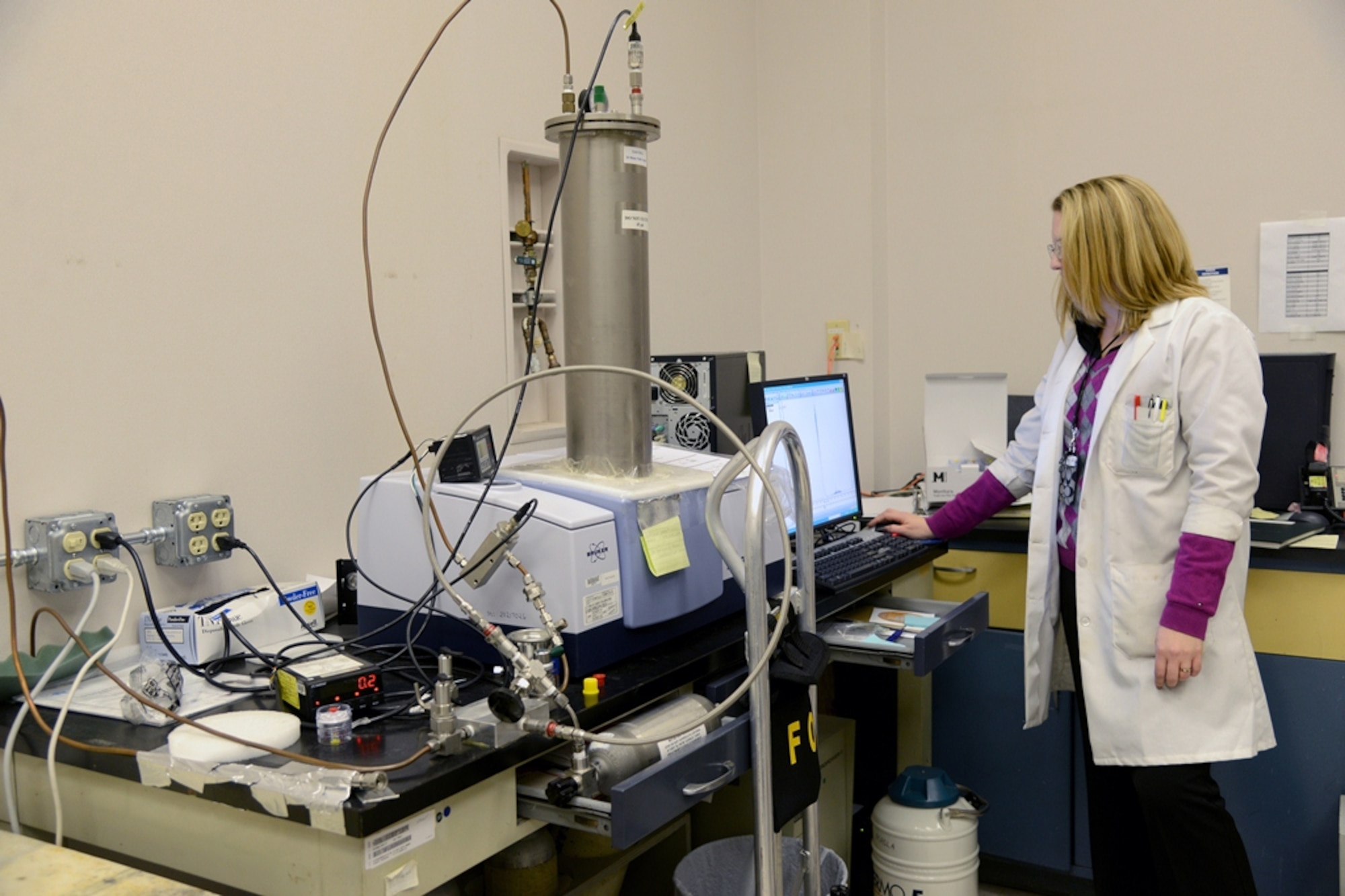 Koree Clanton-Arrowood, a chemist for the 76th Maintenance Support Squadron, checks the results of the quality of breathing air samples which she has gathered from buildings across base, as well as argon and liquid oxygen samples which have been provided to the lab for testing. (Air Force photo by Kelly White)