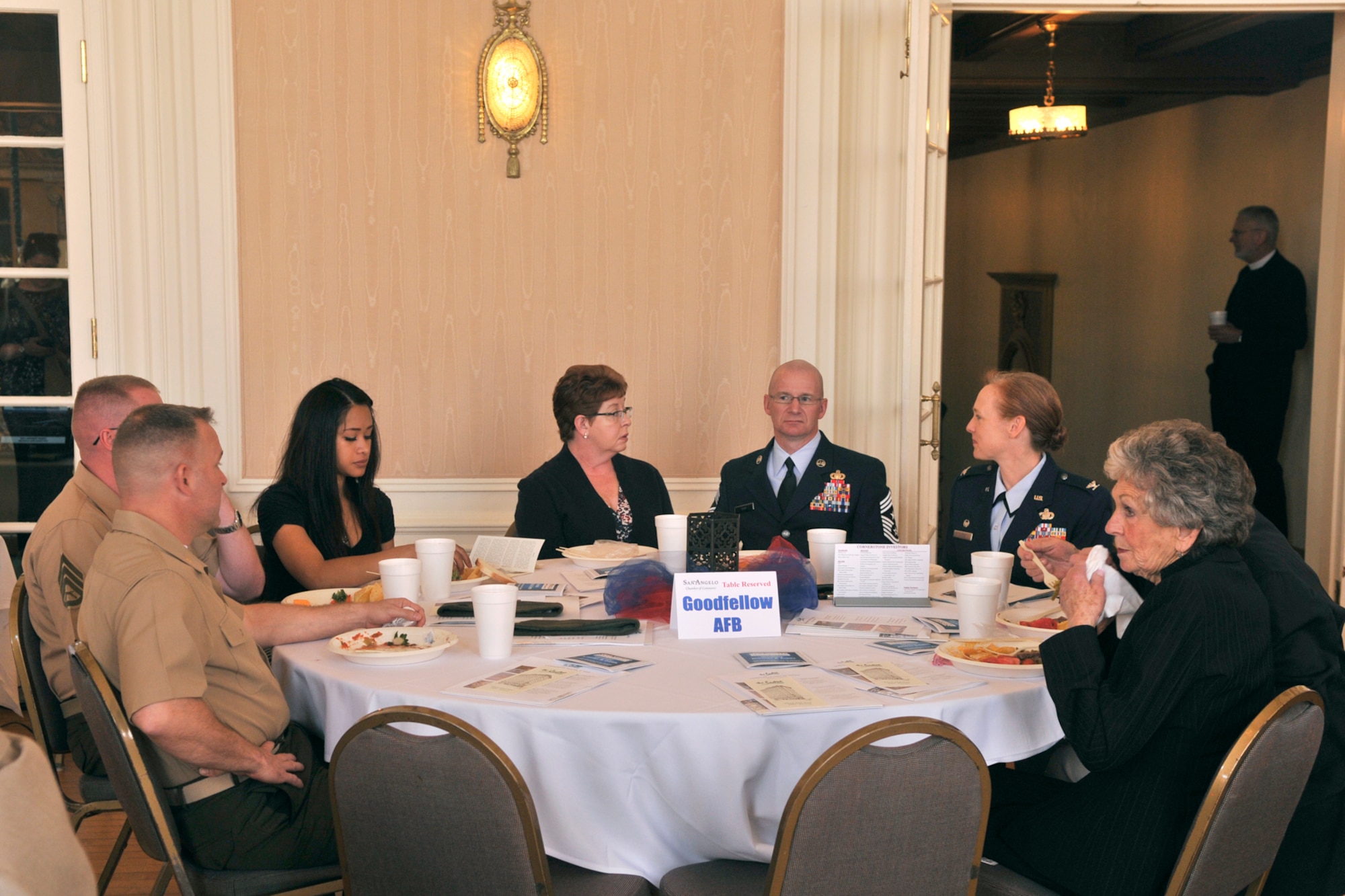 SAN ANGELO, Texas – Goodfellow Air Force Base members gather around a table at the Cactus Hotel during a Chamber of Commerce membership luncheon March 11. The luncheon consisted of an Order of Merit presentation and a speech by Col. Kimberlee Joos, 17th Training Wing Commander. (U.S. Air Force Photo/ Airman 1st Class Devin Boyer)