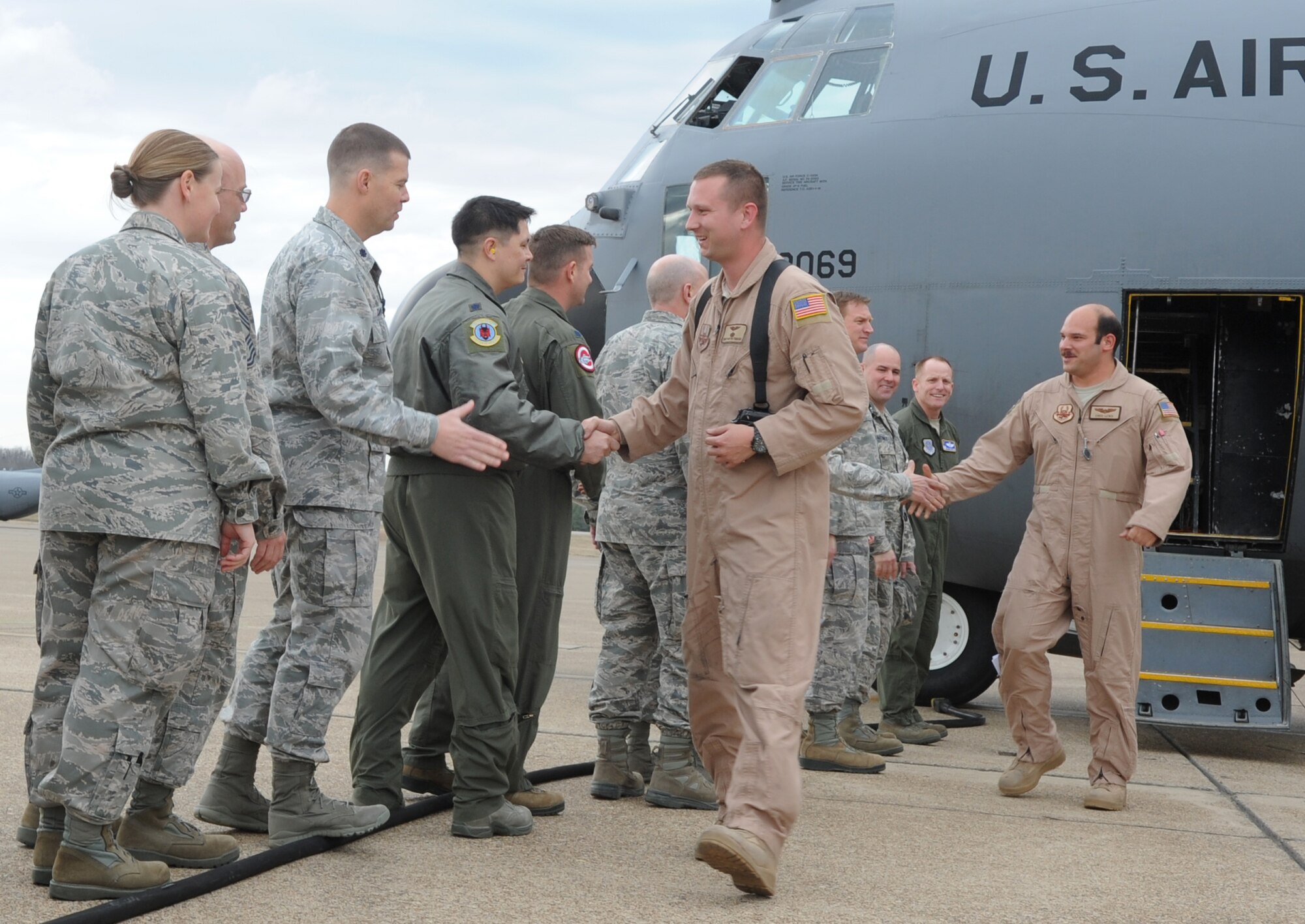 Wing and squadron leadership welcome home redeployers March 14, 2014, at Little Rock Air Force Base, Ark. The Airmen returned from a two-month deployment in Southwest Asia.  (U.S. Air Force photo by Staff Sgt. Caleb Pierce)  