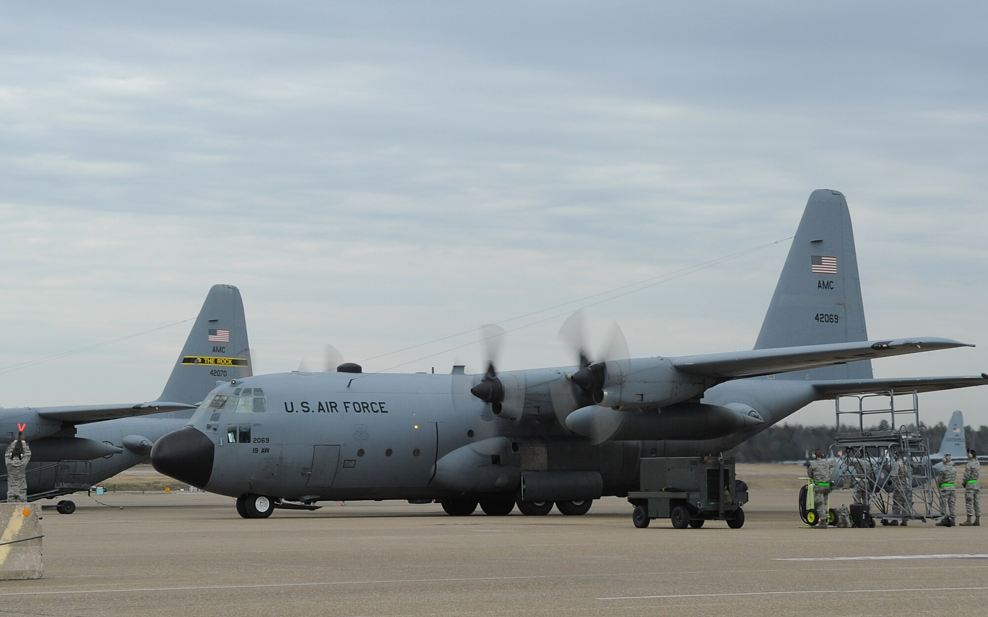 A C-130H assigned to the 50th Airlift Squadron, taxis into a spot after returning from a deployment March 14, 2014, at Little Rock Air Force Base, Ark.  The C-130H was the last of two H models to return to the Rock after supporting contingency operations overseas. The 61st AS returned the first H model earlier that day. (U.S. Air Force photo by Staff Sgt. Caleb Pierce)
