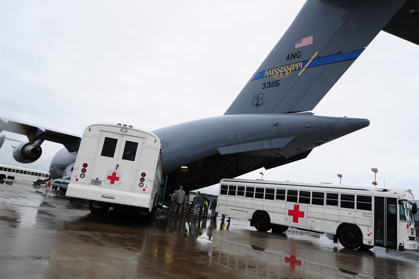 Personnel from the 86th Contingency Aeromedical Staging Facility load patients on a C-17 Globemaster III at Ramstein Air Base, Germany, Dec. 19, 2013. The CASF’s primary role in the aeromedical evacuation mission is to evaluate patients’ medical records, stage patients and secure appropriate transportation for higher-level care. (U.S. Air Force photo/Airman 1st Class Aaron Stout)