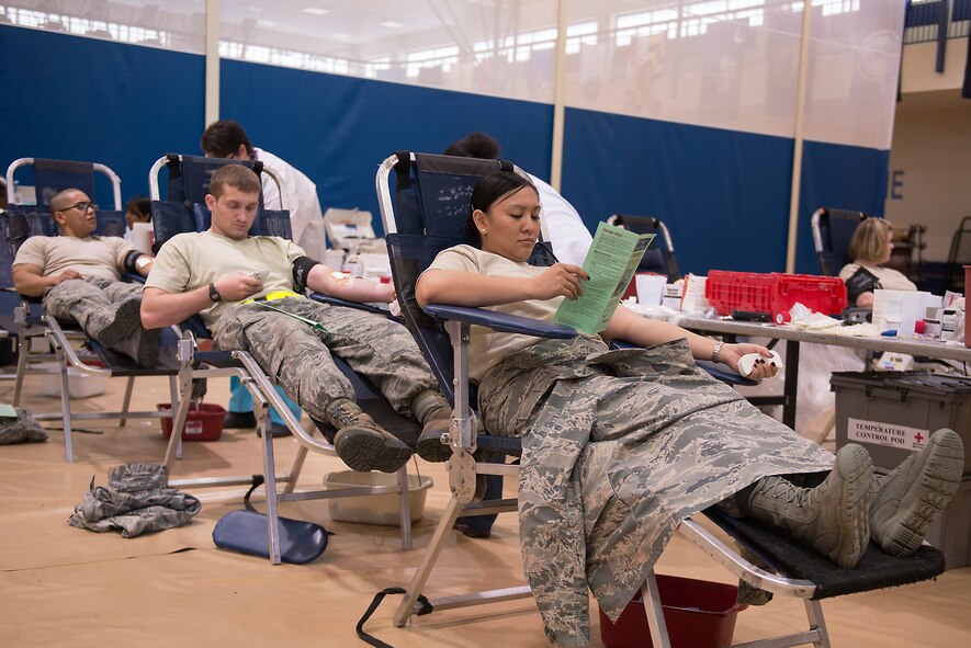 U.S. Air Force Airmen donate blood at the Freedom 1 Fitness Center at Moody Air Force Base, Ga., March 19, 2014. Of the 73 people who registered, 66 were eligible to donate, resulting in 79 units of blood collected. The next fitness center blood drive is scheduled for May 28 from 11 a.m. to 4 p.m. (U.S. Air Force photo by Senior Airman Tiffany M. Grigg/Released) 