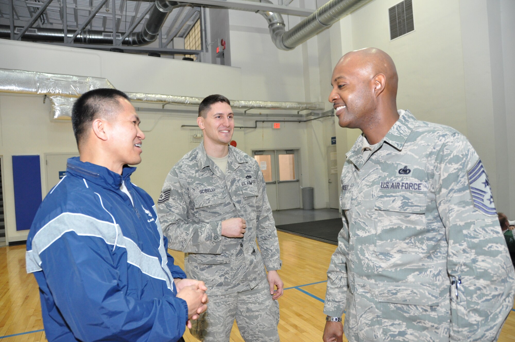 Command Chief Master Sergeant Cameron B. Kirksey, Air Force Reserve Command, Robins Air Force Base, Ga., discusses fitness testing with Tech. Sgt. Eustaquio Devilla, 459th Aeromedical Staging Squadron medical technician, at the East Fitness Center here on March 15, 2014. Kirksey spent the day with members of the 459th Air Refueling Wing to gain first-hand insight on daily operations throughout the wing. (U.S. Air Force photo/ Staff Sgt. Amber Russell)