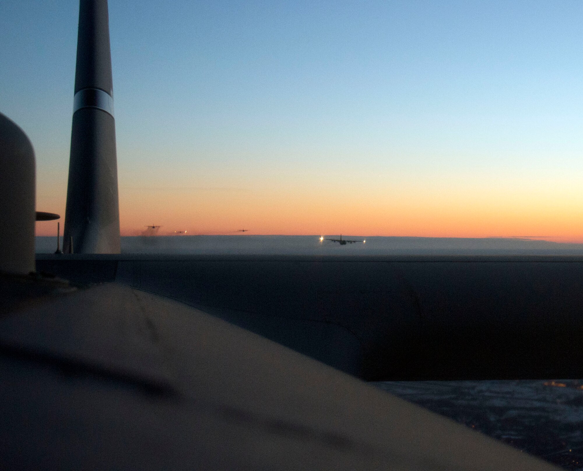 Off into the distance, Airmen from the 109th Airlift Squadron and 96th Airlift Squadron fly in formation in St. Paul, Minn., Mar. 14, 2014. The Airmen participated in an eight-ship C-130 Hercules interfly training mission. This training was a unique opportunity for both squadrons to share C-130 tactics and techniques in adverse weather conditions and wearing night-vision goggles in a low-level flying environment.
(U.S. Air National Guard photo by Tech. Sgt. Amy M. Lovgren/Released)