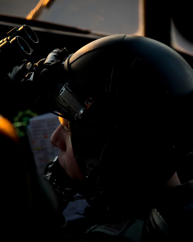 1st Lt. Timothy Oltman, 109th Airlift Squadron, waits for clearance to taxi in St. Paul, Minn., Mar, 14, 2014. Oltman participated in an eight-ship C-130 Hercules interfly training mission. This training was a unique opportunity for both squadrons to share C-130 tactics and techniques in adverse weather conditions and wearing night-vision goggles in a low-level flying environment. 
(U.S. Air National Guard photo by Tech. Sgt. Amy M. Lovgren/Released)