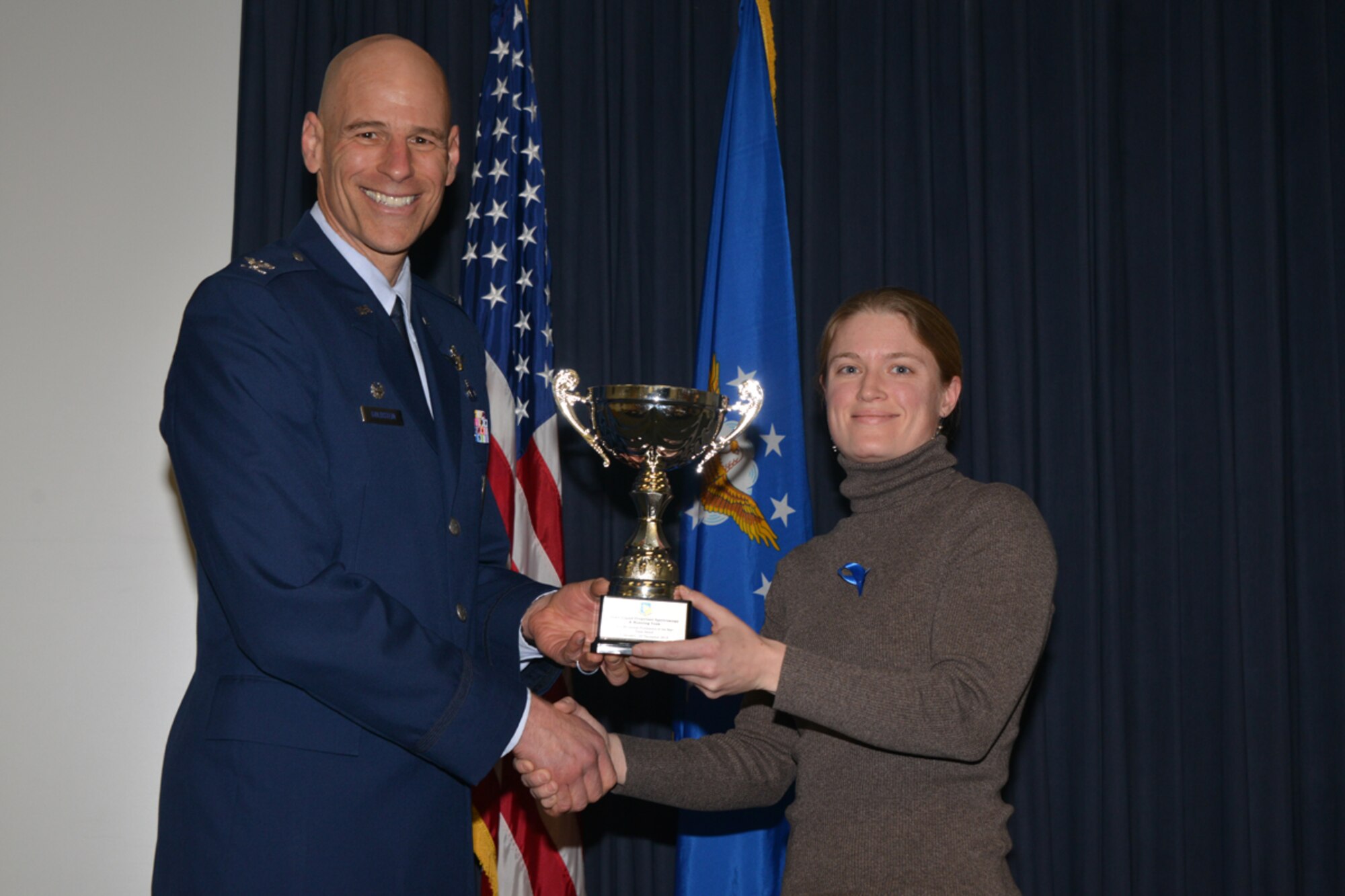 Air Force Research Laboratory scientist Jaime Stearns receives the Publication of the Year team award from Col. David Goldstein, AFRL Space Vehicles Directorate director, at the AFRL 2013 Phillips Research Site annual awards ceremony.  (Photo by Todd Berenger)