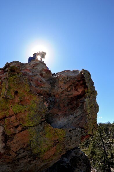 Air Force Reserve Maj. Gregory J. Castro communicates land coordinates to his students from a remote location high above the trees March 14, 2014 at Ute Valley Park in Colorado Springs, Colo. The students participated in a global positioning system exercise that was part of the Space Operations Course, a two-week space fundamentals course for military and civilian non-space personnel, taught by the Reserve National Security Space Institute (RNSSI). Castro is assigned to RNSSI at Peterson Air Force Base, Colo. and is the organization’s chief of the instructor development branch.
(U.S. Air Force photo/Tech. Sgt. Nicholas B. Ontiveros