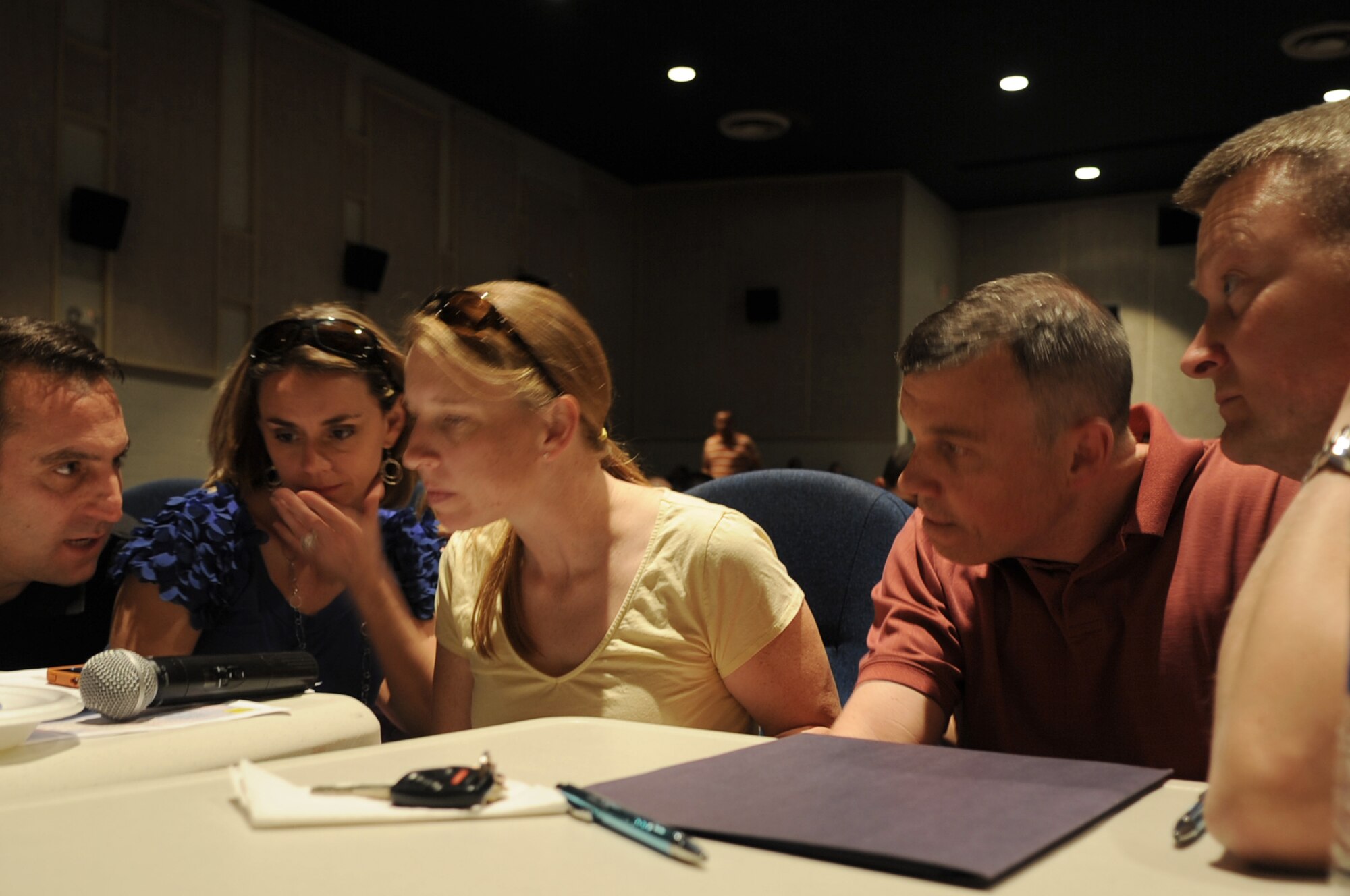 GOODFELLOW AIR FORCE BASE, Texas -- Student’s Got Talent judges confer while making their final decisions during the Student’s Got Talent competition at the Base Theater here March 11. The performers were judged on five elements: talent and competence, stage presence and poise, creativity and originality, overall enjoyment, and audience votes. (U.S. Air Force photo/ Staff Sgt. Laura R. McFarlane)