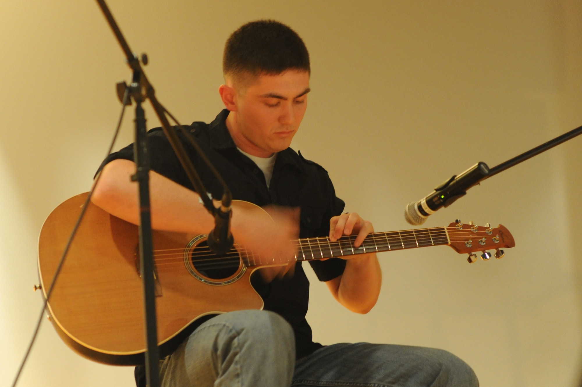 GOODFELLOW AIR FORCE BASE, Texas -- Marine Corps Lance Cpl. Stephan Baxter, Marine Corps Detachment student, plays “Drifting” on the guitar during the Student’s Got Talent competition at the Base Theater here March 11. Baxter won second place in the competition. (U.S. Air Force photo/ Staff Sgt. Laura R. McFarlane)