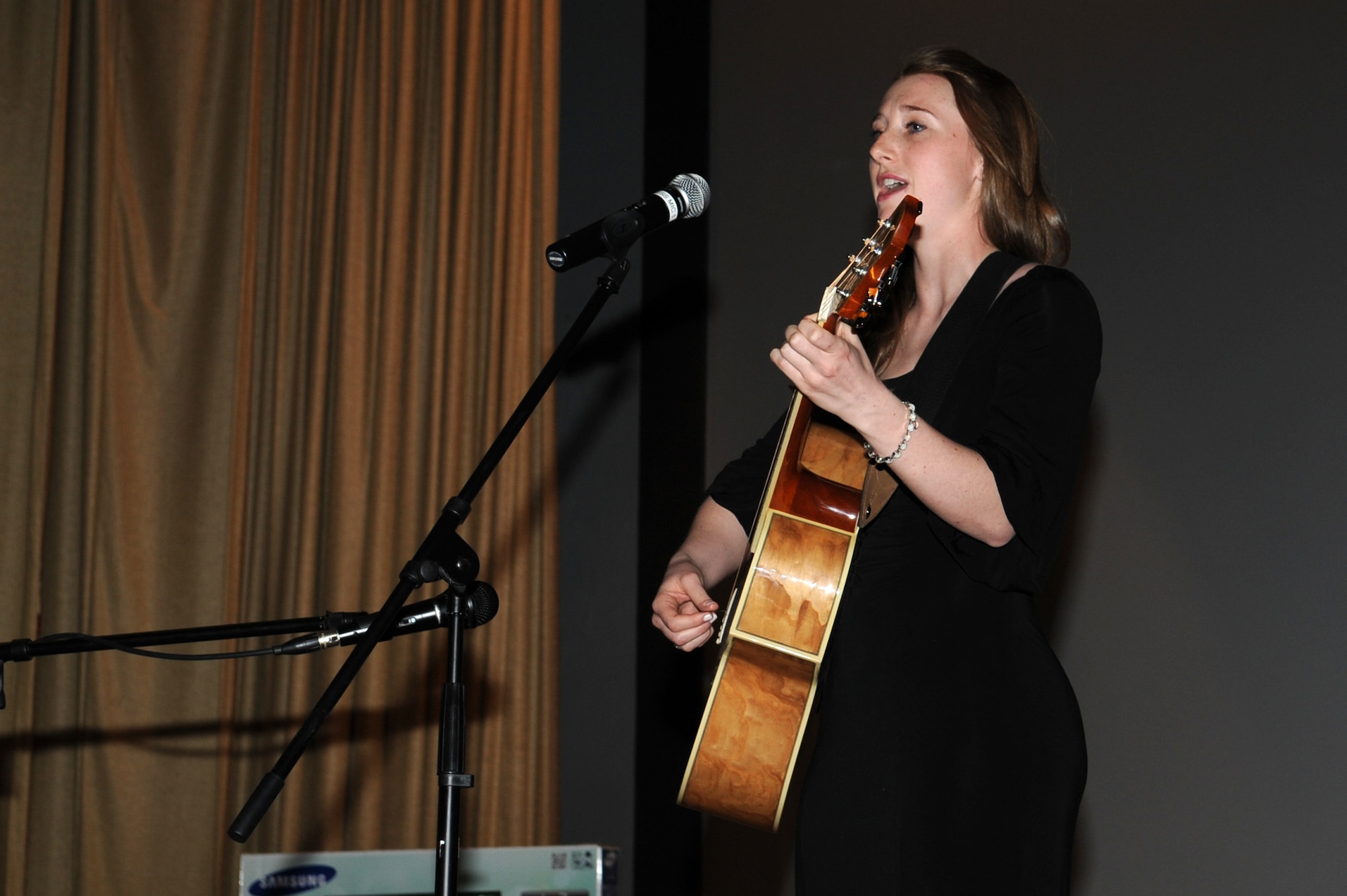 GOODFELLOW AIR FORCE BASE, Texas -- Army Pfc. Carei Calleigh, 344th Military Intelligence Battalion student, sings “Let It Go” from the movie “Frozen” during the Student’s Got Talent competition at the Base Theater here March 11. Ten non-prior service student contestants competed in the finals. (U.S. Air Force photo/ Staff Sgt. Laura R. McFarlane)