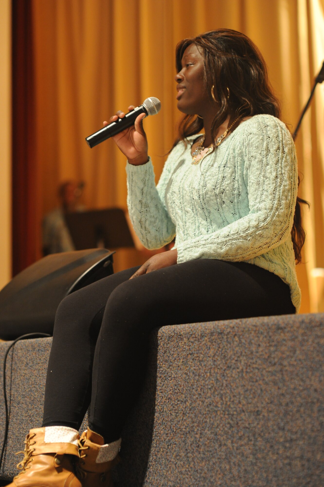 GOODFELLOW AIR FORCE BASE, Texas -- Airman 1st Class Armani Bethely, 312th Training Squadron student, sings during the Student’s Got Talent competition at the Base Theater here March 11. The 17th Training Wing Chapel Office staff hosted the contest that began with general auditions March 4. (U.S. Air Force photo/ Staff Sgt. Laura R. McFarlane)