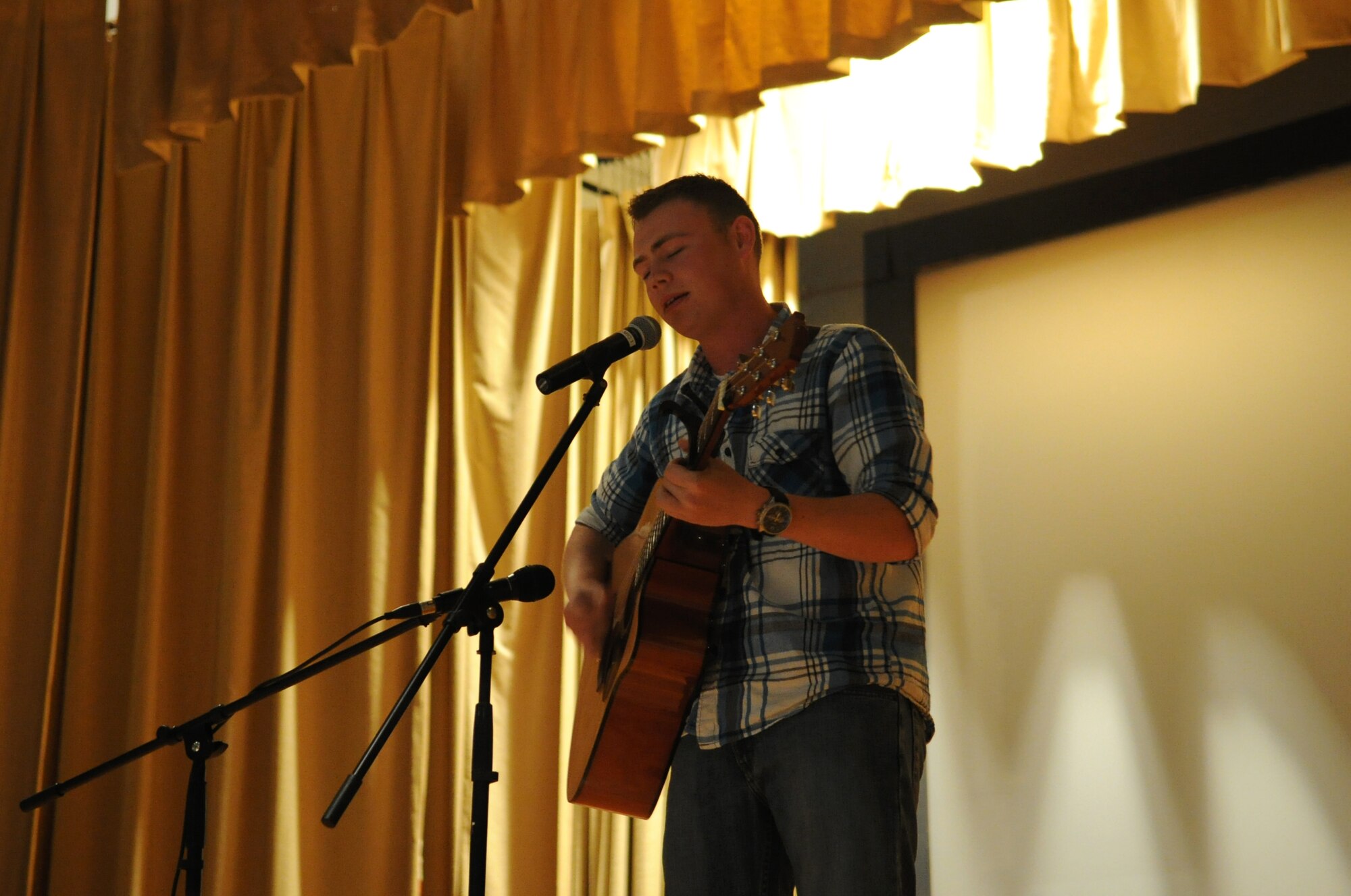 GOODFELLOW AIR FORCE BASE, Texas -- Airman Chancellor Chumley, 315th Training Squadron student, sings “Sleepy Town,” a song he wrote, during the Student’s Got Talent competition at the Base Theater here March 11. Chumley won third place in the competition. (U.S. Air Force photo/ Staff Sgt. Laura R. McFarlane)
