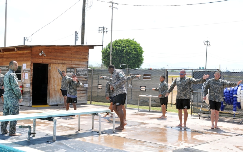 Service members from Joint Task Force-Bravo’s Army Forces Battalion (ARFOR) and Medical Element (MEDEL) train participate during a Combat Water Survival training conducted in the base pool in Soto Cano Air Base, Honduras; Mar. 13, 2014. (Photo by Ana Fonseca)



