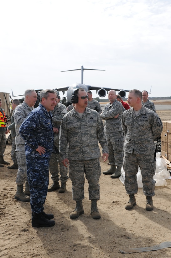 JOINT BASE MCGUIRE-DIX-LAKEHURST, N.J. – Vice Adm. William A. Brown, U.S.
Transportation Command, deputy commander is briefed by Col Michael B. Frymire
817 Contingency Response Commander with SMSgt Dominic Mazza, 817 CRG EC,
at Exercise EAGLE FLAG 14-1 and 14-2.  EAGLE FLAG is a strategic exercise to execute and evaluate the span of mobility operation and expeditionary combat support skills  requested by combatant commands.  (U.S. Air Force photo by Brad Camara)
