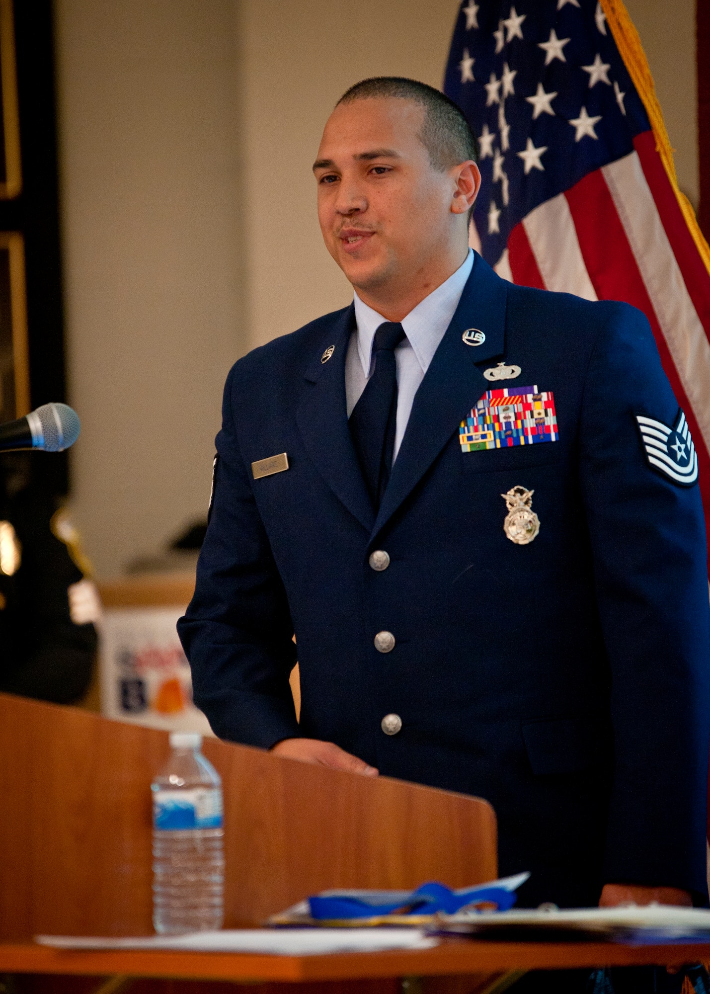 Tech. Sgt. Brian Williams, 87th Security Forces Squadron military working dog handler, addresses the audience at the second annual K-9 Veterans Day celebration March 14, 2014, at the Bergen County Law and Public Safety Institute in Mahwah, N.J. Williams, a wounded warrior, was seriously injured during a 2012 mission in Southern Afghanistan. “I am really happy and humbled to be here today before you, not watching above you,” he said. (U.S. Air Force photo by Staff Sgt. Scott Saldukas/Released)