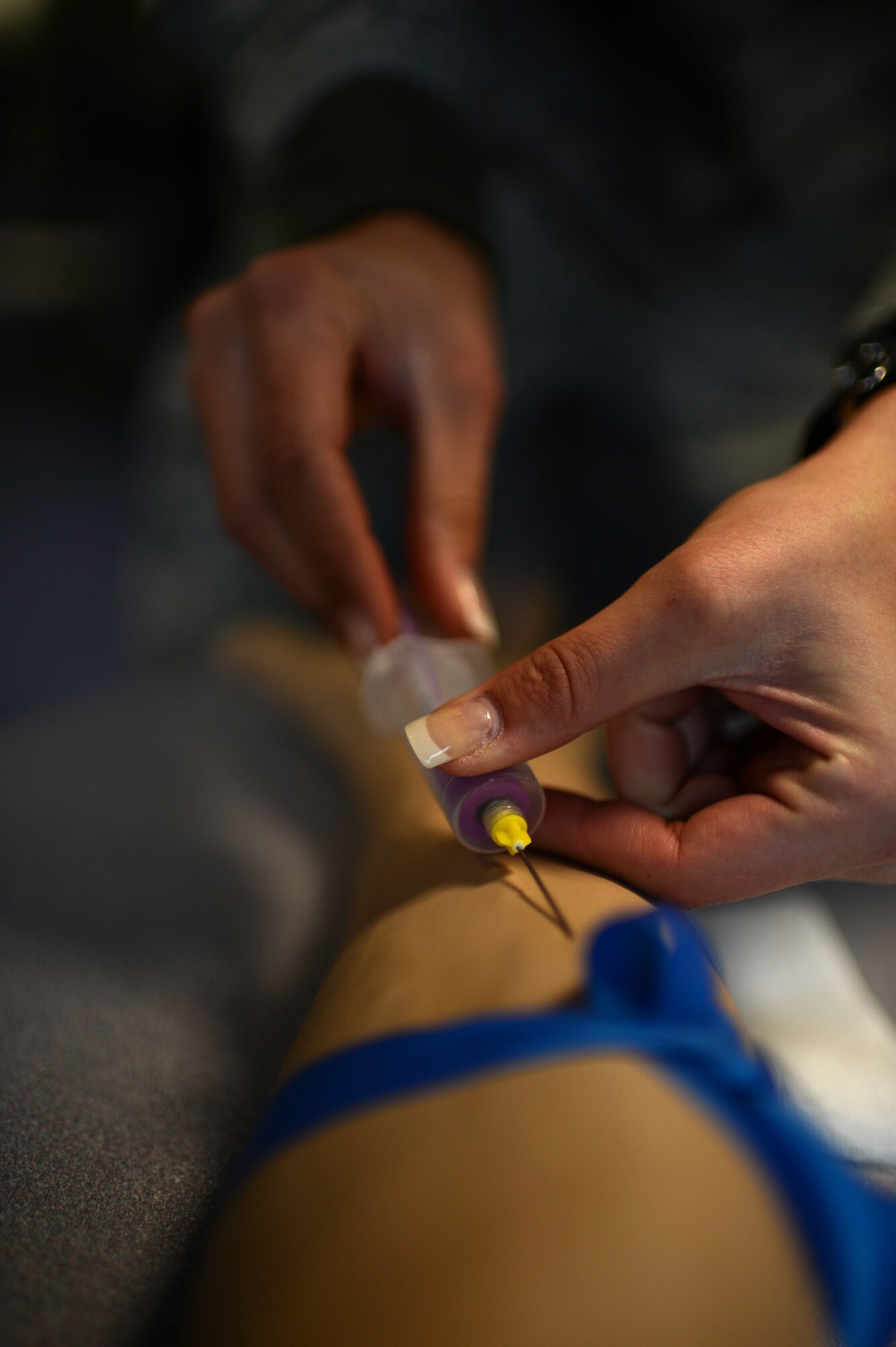 U.S. Air Force Staff Sgt. Elizabeth Butler, 52nd Medical Operations Squadron aerospace medical technician from Tampa, Fla., practices taking blood on a dummy arm during a skills training class March 19, 2014 at Spangdahlem Air Base, Germany. The 52nd Medical Group conducted training for aerospace medical technicians and nurses so they remain up-to-date on all required skills to be mission ready. (U.S. Air Force photo by Senior Airman Gustavo Castillo/Released)