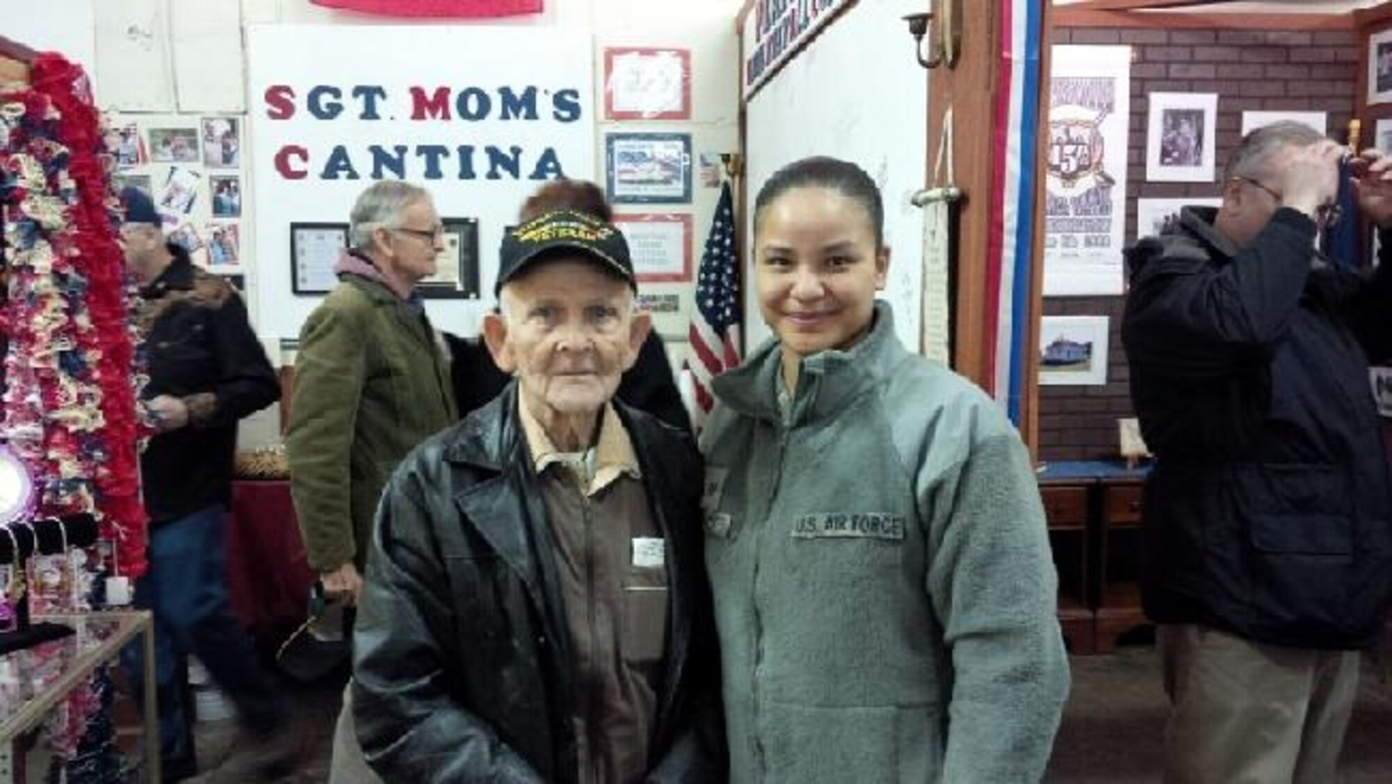 Staff Sgt. Anastacia Isaacs, 332nd Recruiting Squadron H Flight recruiter (right), poses with a military veteran during the Veterans Information Center and Sgt. Mom’s Cantina grand opening ceremony in Elizabethtown, Ky., Feb. 7. (U.S. Air Force photo/Tech. Sgt. Michael Smith) 