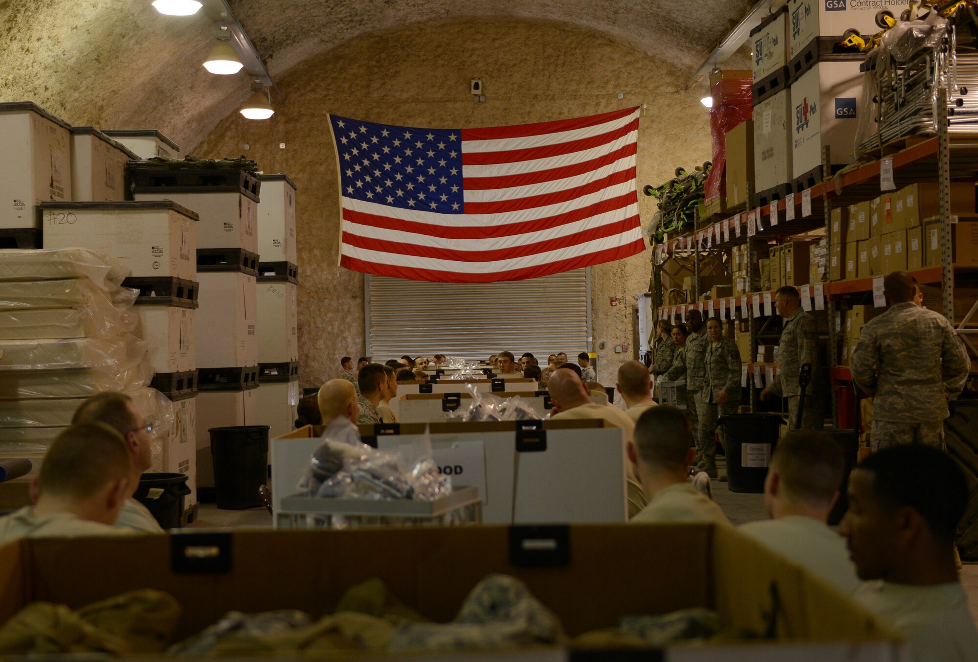 Airmen deployed to the 379th Air Expeditionary Wing volunteer to re-certify Individual First Aid Kits at Al Udeid Air Base, Qatar, Mar. 14, 2014. Service members who deploy are issued IFAKs for temporary medical assistance, until they can reach further medical care. All items inside the IFAK that expire within a year must be replaced before they can be re-certified. Once items inside the IFAK have been verified, they are sealed with a tag and service receipt to guarantee the IFAK has not been tampered with. (U.S. Air Force photo/Senior Airman Hannah Landeros)