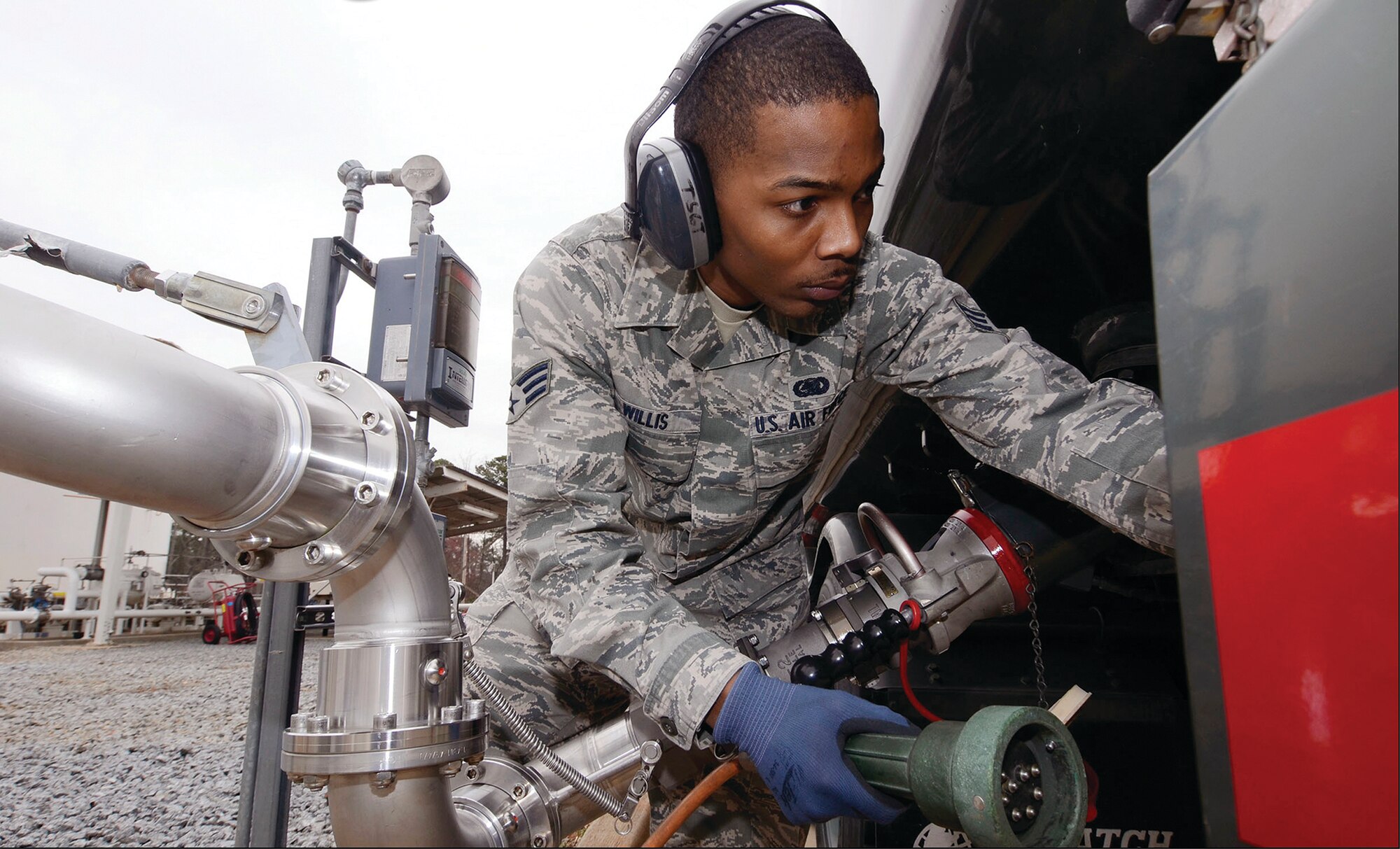 Senior Airman Vincent N. Willis of the 94th Logistic Readiness Squadron prepares to transfer aviation fuel into a transport truck prior to delivery to an aircraft at Dobbins Air Reserve Base, Ga., March 1. Dobbins recently made the switch from JP-8 to Jet A fuel. (Don Peek)