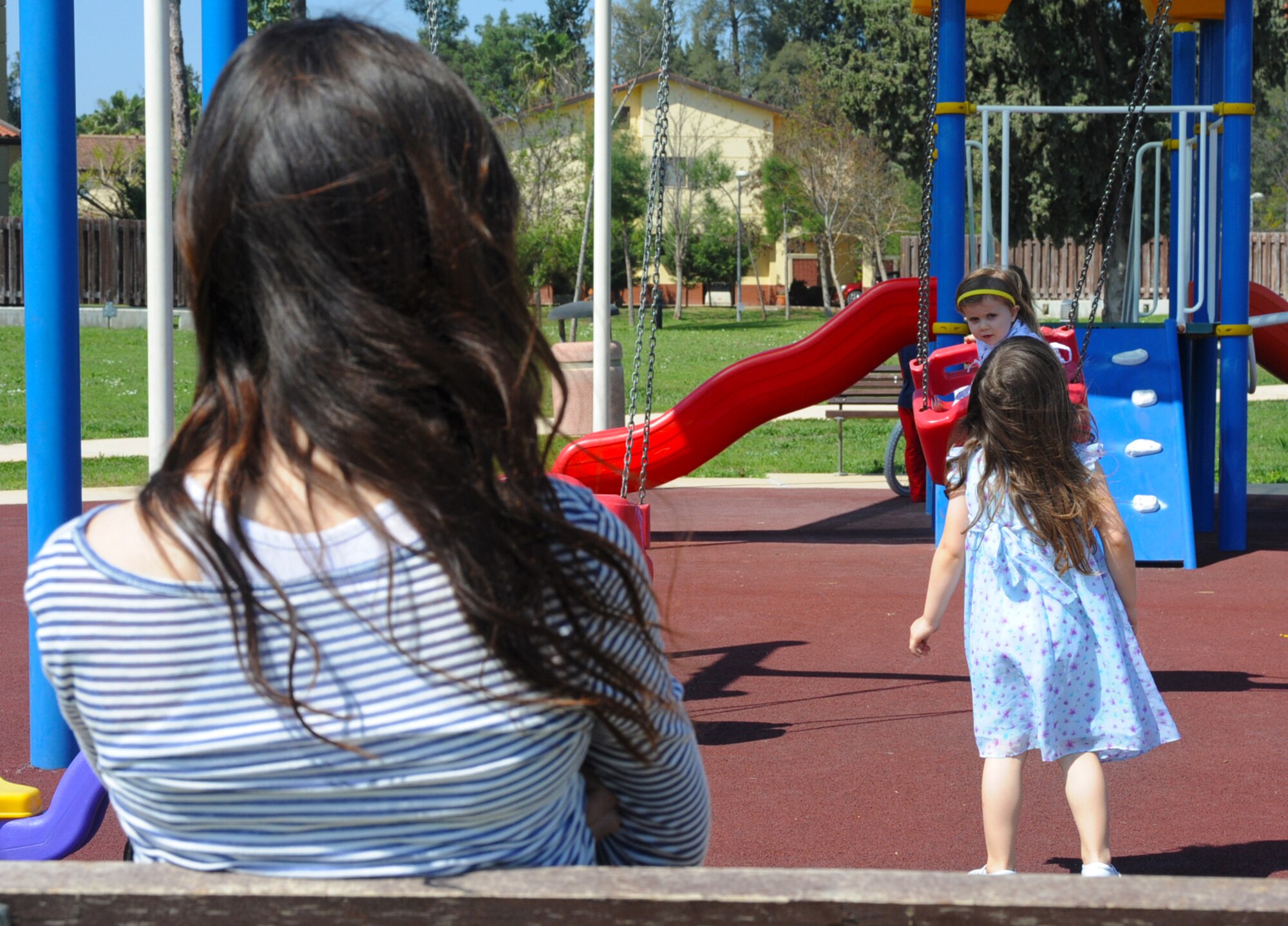 A caregiver supervises children under their care at a playground March 20, 2014, Incirlik Air Base, Turkey. All nannies offering services to U.S. personnel on Incirlik Air Base will soon be trained and certified in CPR and first aid per new guidance that will take effect May 1, 2014. This policy comes as a result of community input from a recent Caring for People Forum regarding the ability of nannies to provide first aid to the children in their care in the event of an emergency. (U.S. Air Force photo by 1st. Lt. David Liapis/Released)
