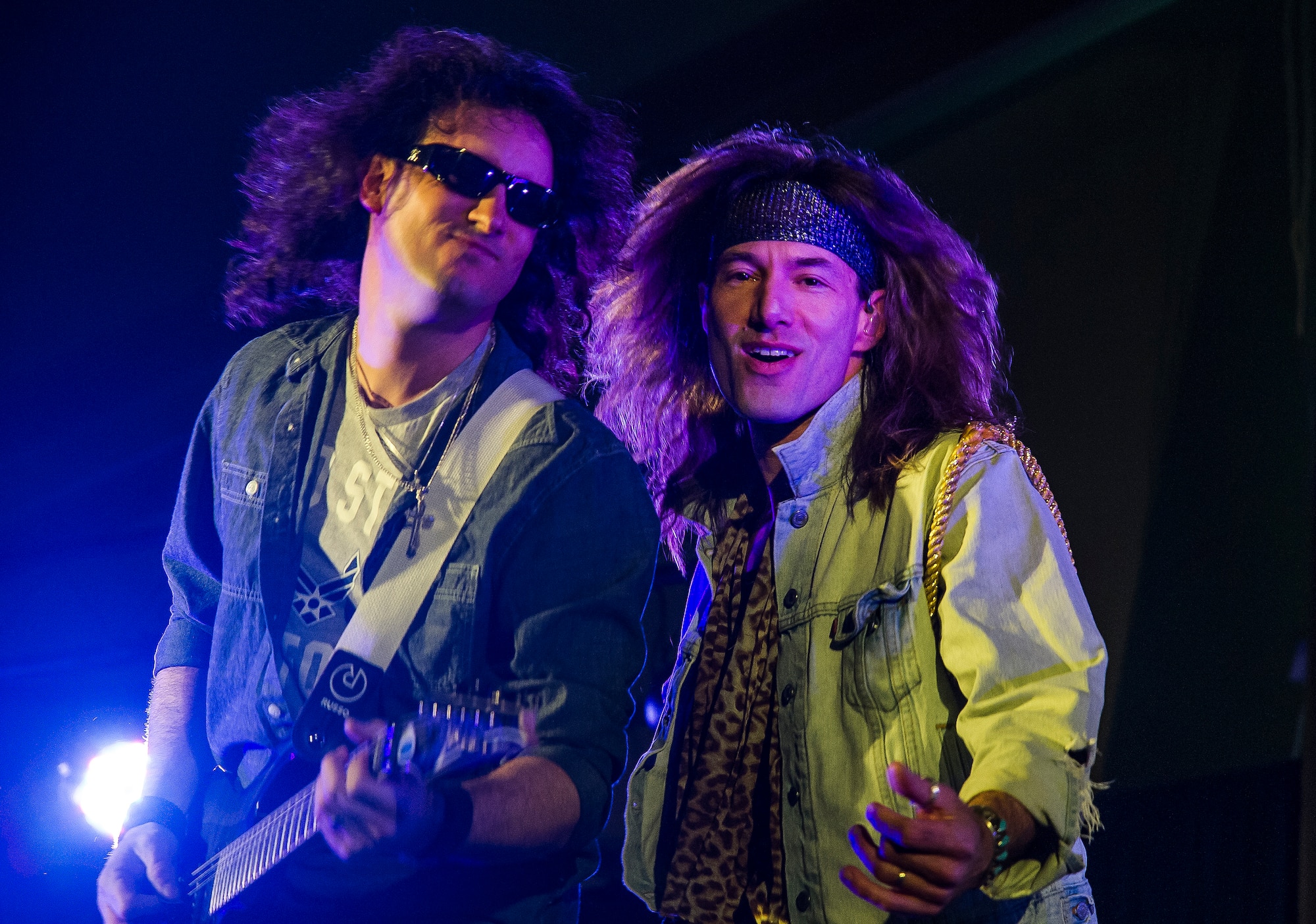 Anthony Cappolino, Slippery When Wet guitarist, and Jason Morey, Slippery When Wet lead singer, perform during a show at Transit Center at Manas, Kyrgyzstan, March 17, 2014. The band is comprised of members Morey, Cappolino, Brian Nelson, bass, and John Martin, drums.  (U.S. Air Force photo/Senior Airman George Goslin)

